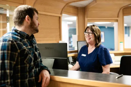 health c是 professional greets a student