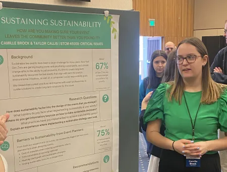 Camille Brock (24') presenting her poster.