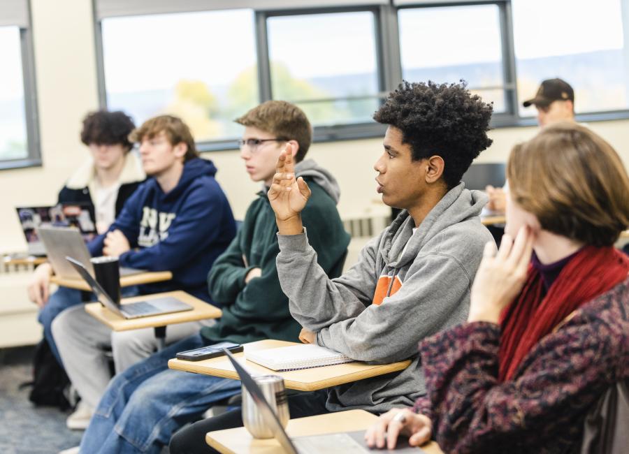 Students discussing inc lass. 