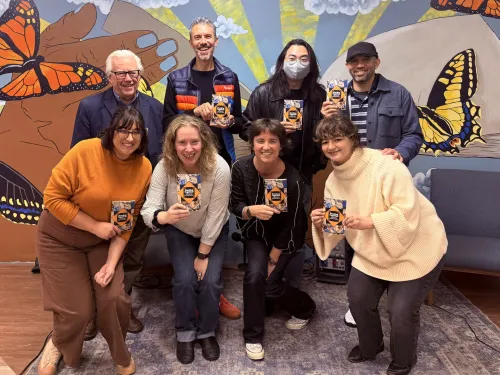 Department of Literature's in English professors holding copies of reading together