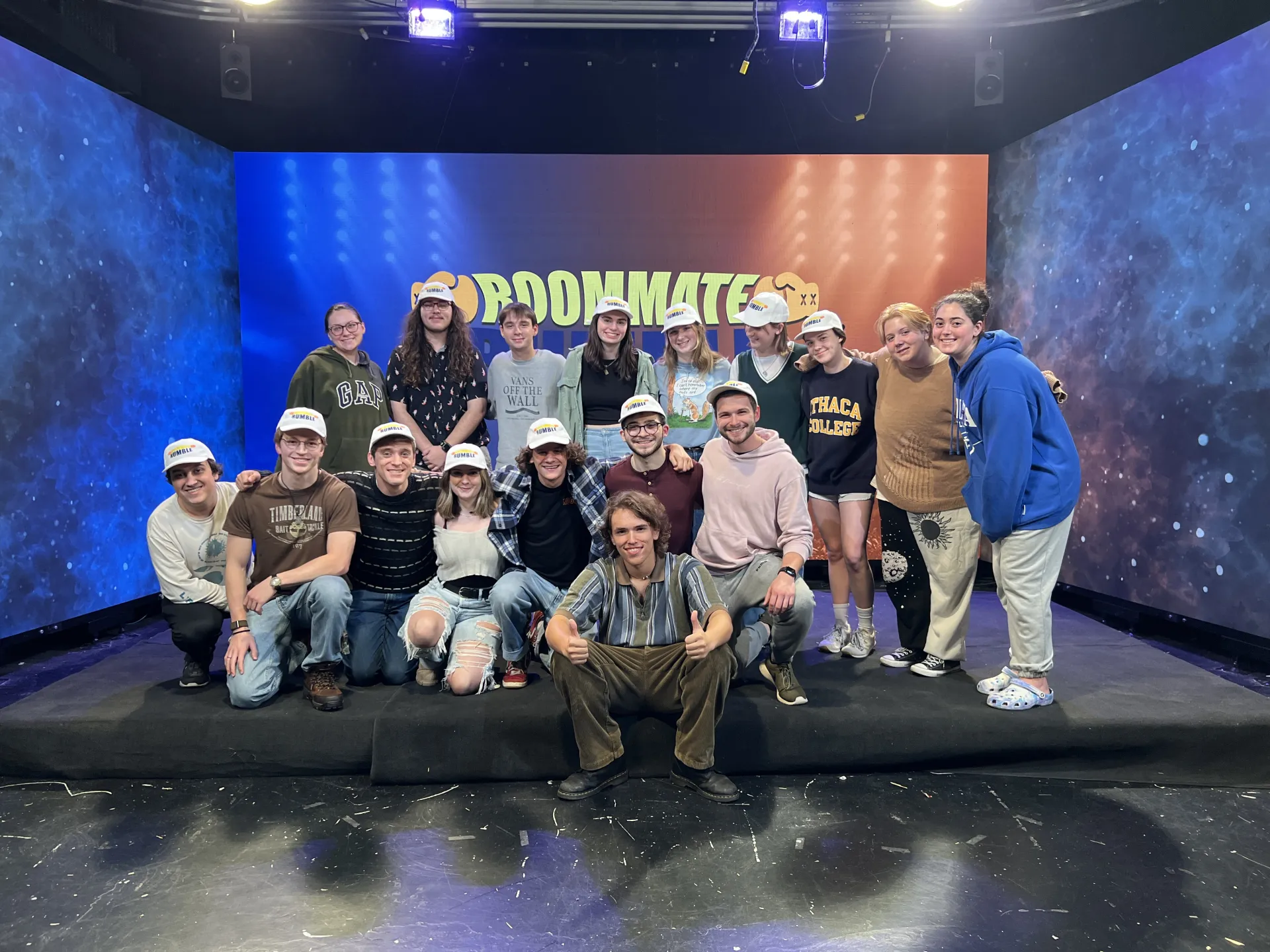 Cody posing with the nba买球正规官方网站TV cast